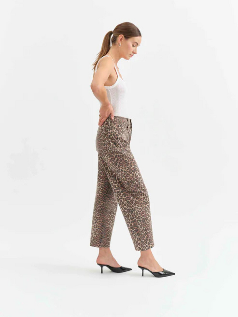 Stylish DAZE DENIM - Westward Barrel Leg Jeans in cheetah print, offering a bold look and flattering fit. Perfect for any occasion.