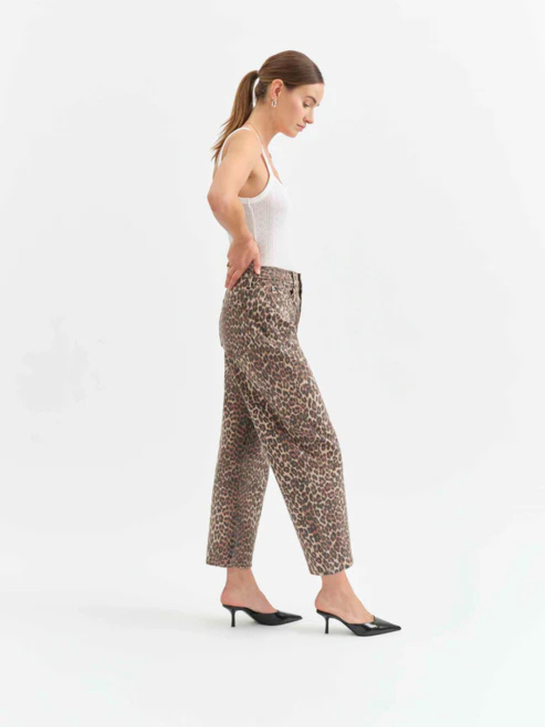 Stylish DAZE DENIM - Westward Barrel Leg Jeans in cheetah print, offering a bold look and flattering fit. Perfect for any occasion.
