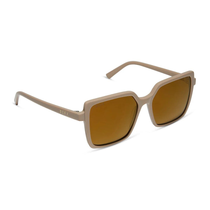 Beige-framed sunglasses with brown tinted lenses on a white background.