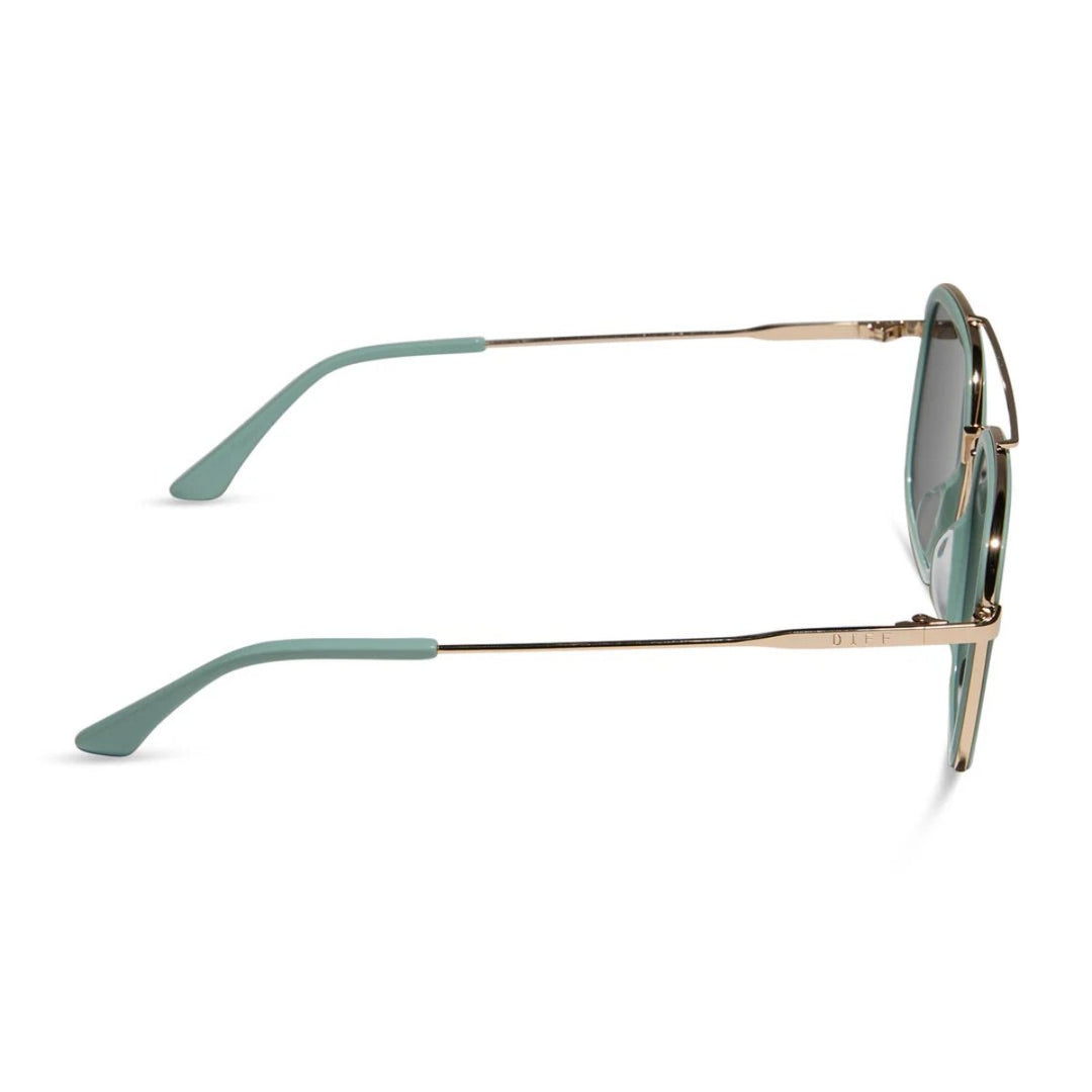 Square-framed sunglasses with gold metal arms and dark lenses on a white background.