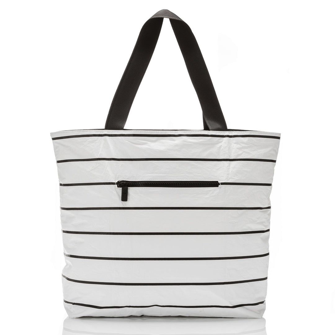 Back of the white and black Pinstripe Day Tripper tote showing the outside zipper pocket