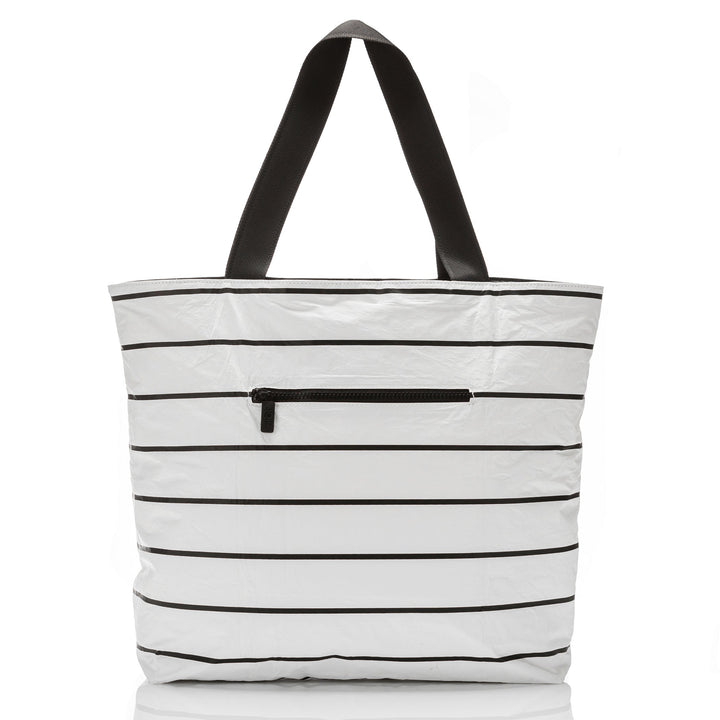 Back of the white and black Pinstripe Day Tripper tote showing the outside zipper pocket