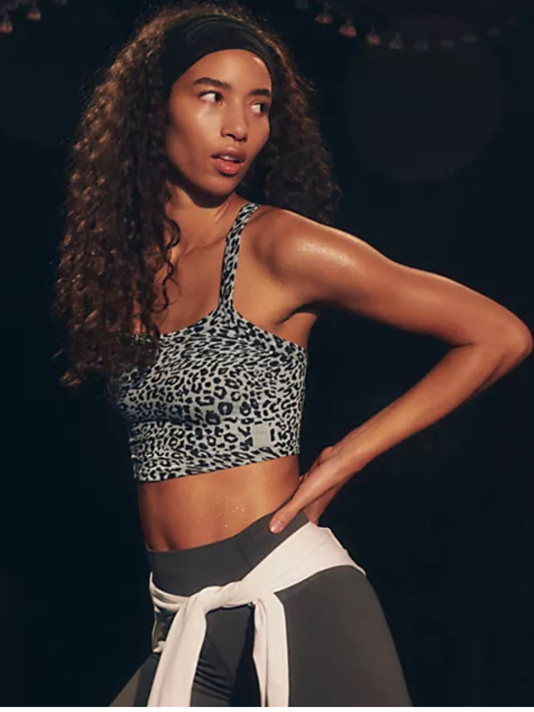 Flirty and fitted, the FREE PEOPLE - All Clear Cami Leopard Top features a chic criss-cross back for effortless style.