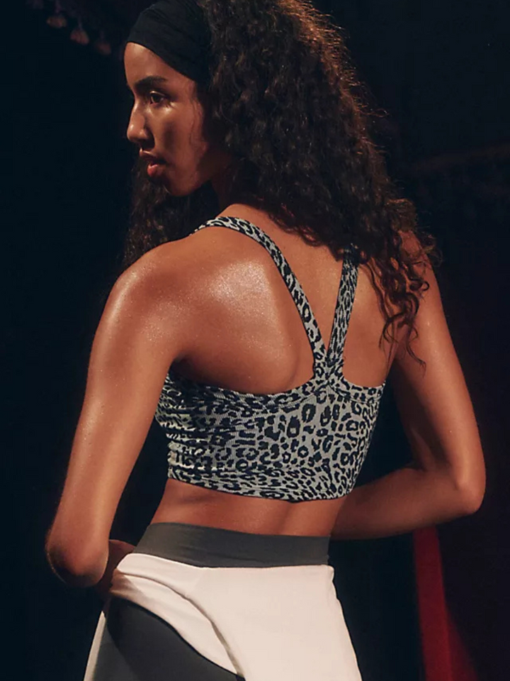 Flirty and fitted, the FREE PEOPLE - All Clear Cami Leopard Top features a chic criss-cross back and square neckline.