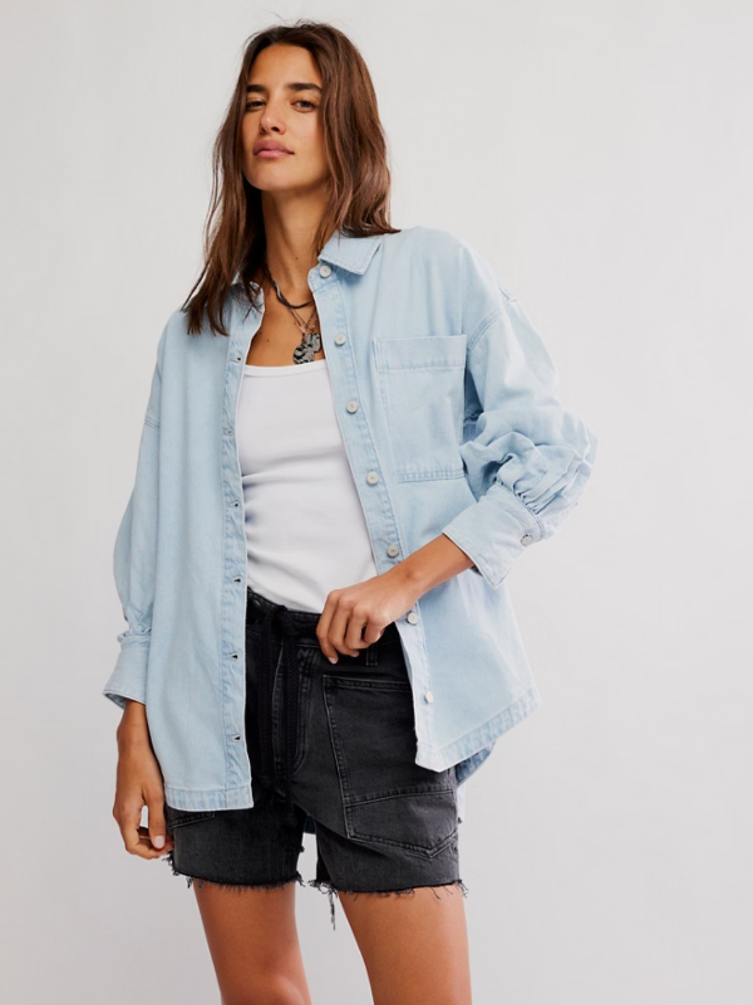 Effortlessly stylish, the FREE PEOPLE - Ashley Denim Shirt features an oversized fit perfect for casual layering.