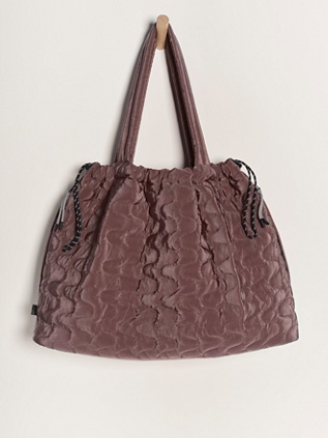 FREE PEOPLE - Cloud 9 Tote Bag features a slouchy, quilted design perfect for workouts and weekend getaways.