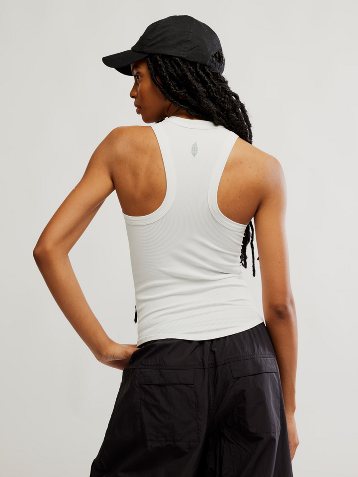 Stylish and sporty, the FREE PEOPLE - Dynamite Tank Top features a fitted silhouette and racerback design for mobility.