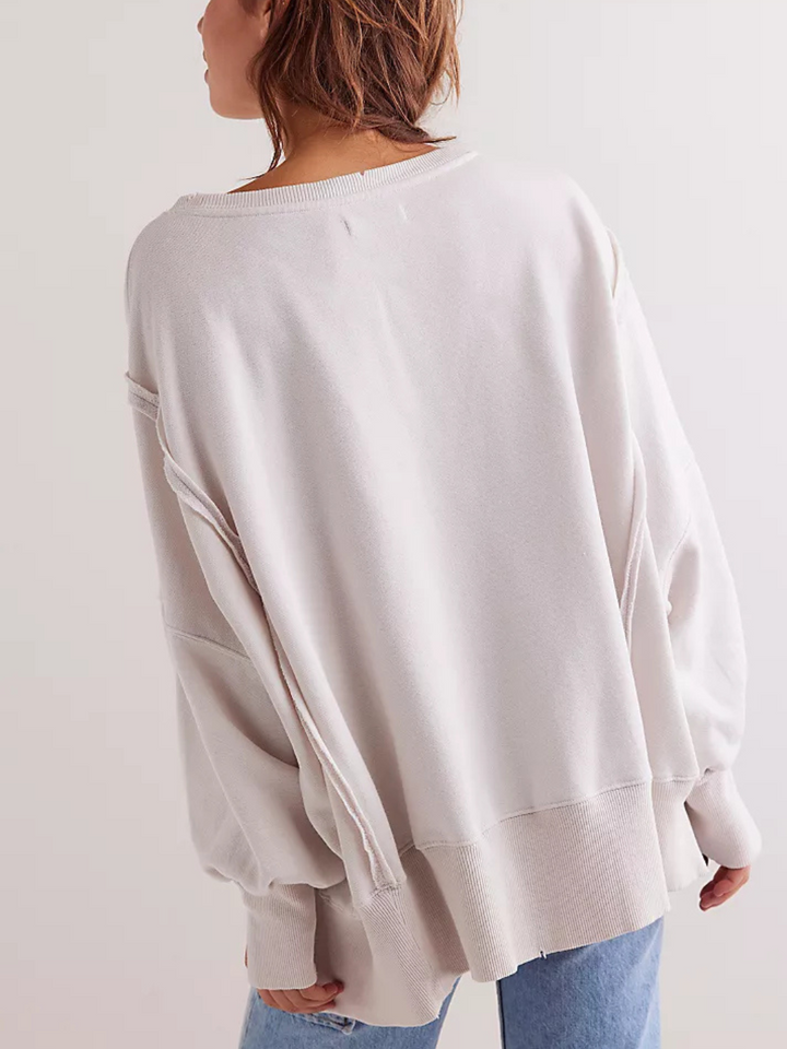 Relaxed silhouette of the FREE PEOPLE - Graphic Camden Highland Cow long sleeve, perfect for a vintage-inspired look.