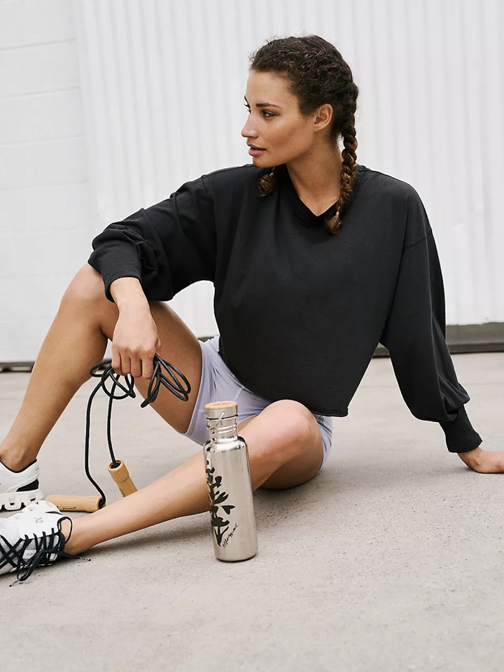 FREE PEOPLE - Inspire Layer long sleeve tee in black, perfect for effortless layering and casual style.