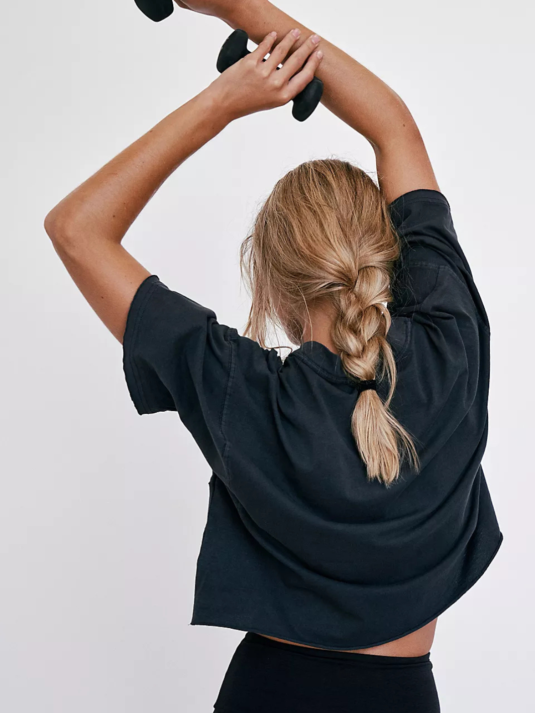 Stylish and comfy, the FREE PEOPLE - Inspire Tee features an oversized silhouette perfect for workouts and casual wear.