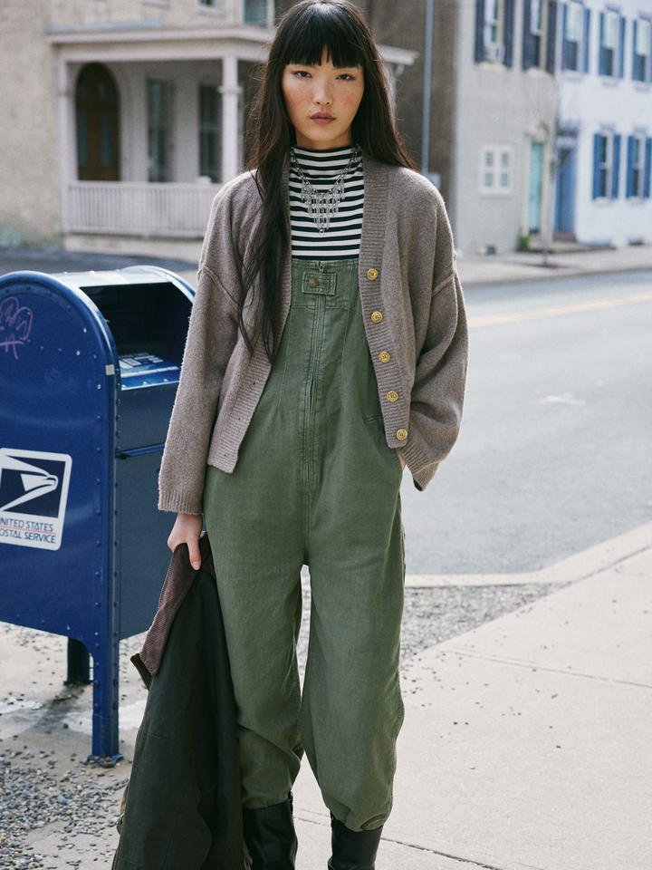 Stylish model in FREE PEOPLE - Jude One Piece Jumpsuit, showcasing relaxed denim and effortless layering vibes.