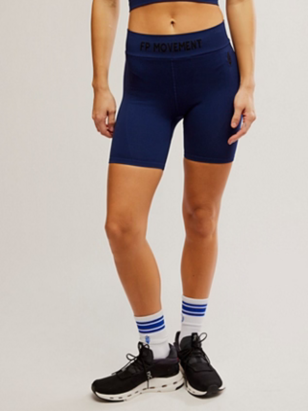 FREE PEOPLE - Long Haul Bike Short features a high-rise fit and logo waistband, perfect for workouts and lounging.