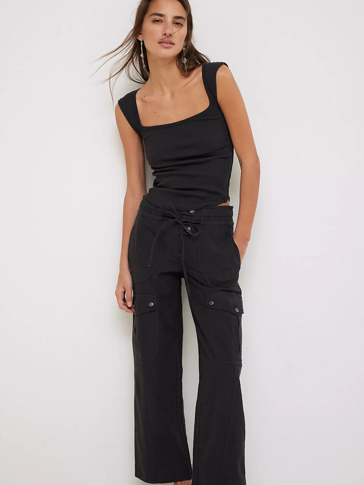 Stylish model showcasing FREE PEOPLE - Park Ave Pant, featuring a slim fit and cargo-inspired design for modern flair.