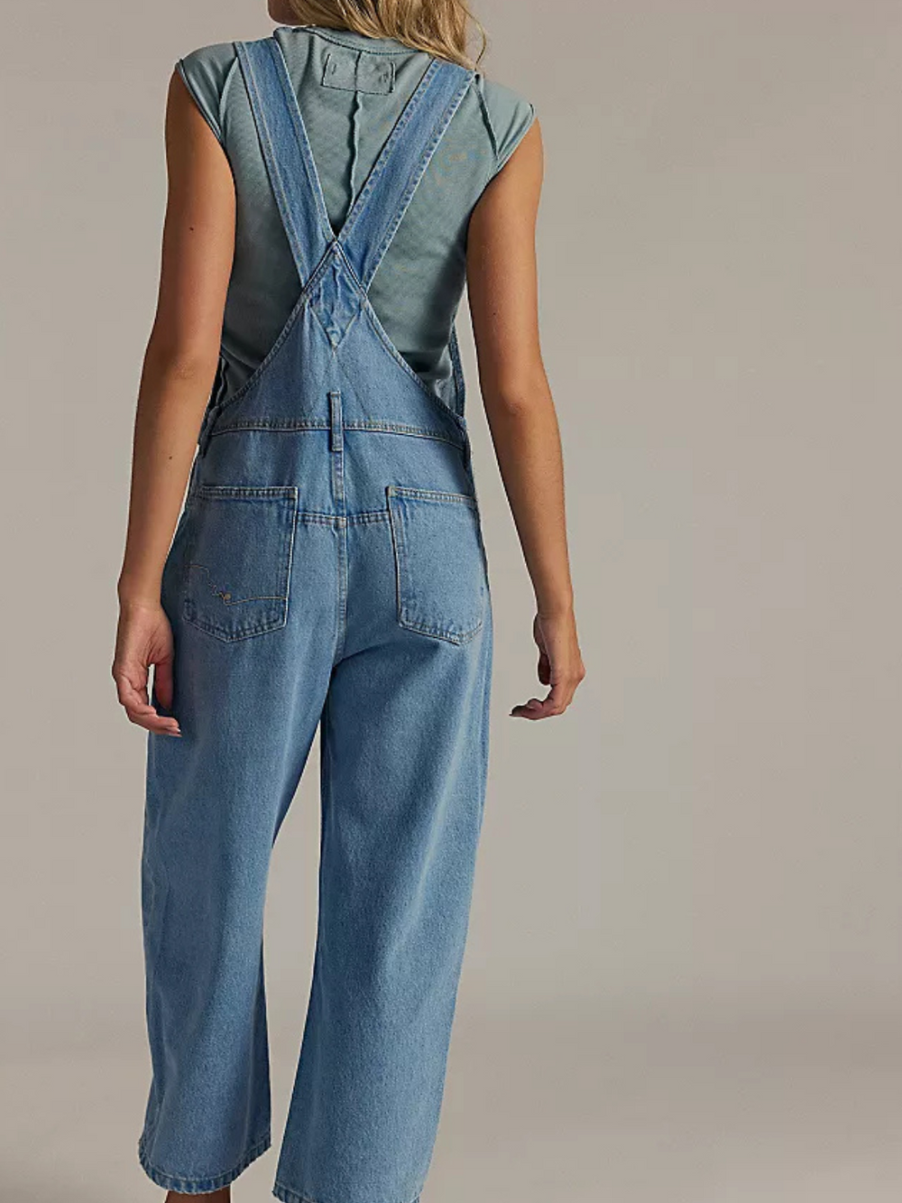 Relaxed fit of FREE PEOPLE - We The Free Deep Trance Overalls, showcasing a cool, utility style for everyday wear.