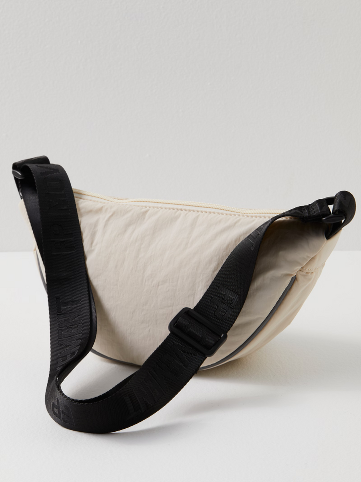 Sleek and functional, the FREE PEOPLE MOVEMENT - Bulls Eye Sling Bag is perfect for stylish on-the-go adventures.