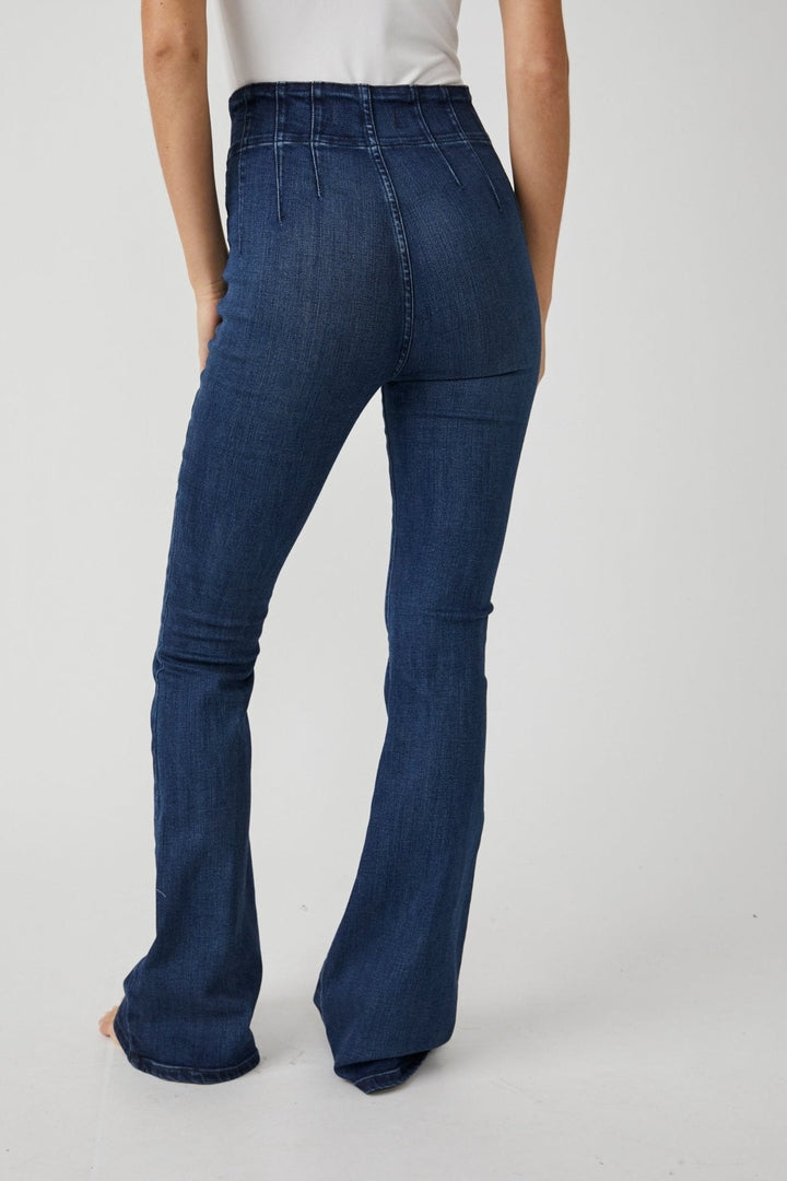 Trendy high rise jeans by Free People, made from flexible denim fabric, perfect for a fashionable and comfortable fit.