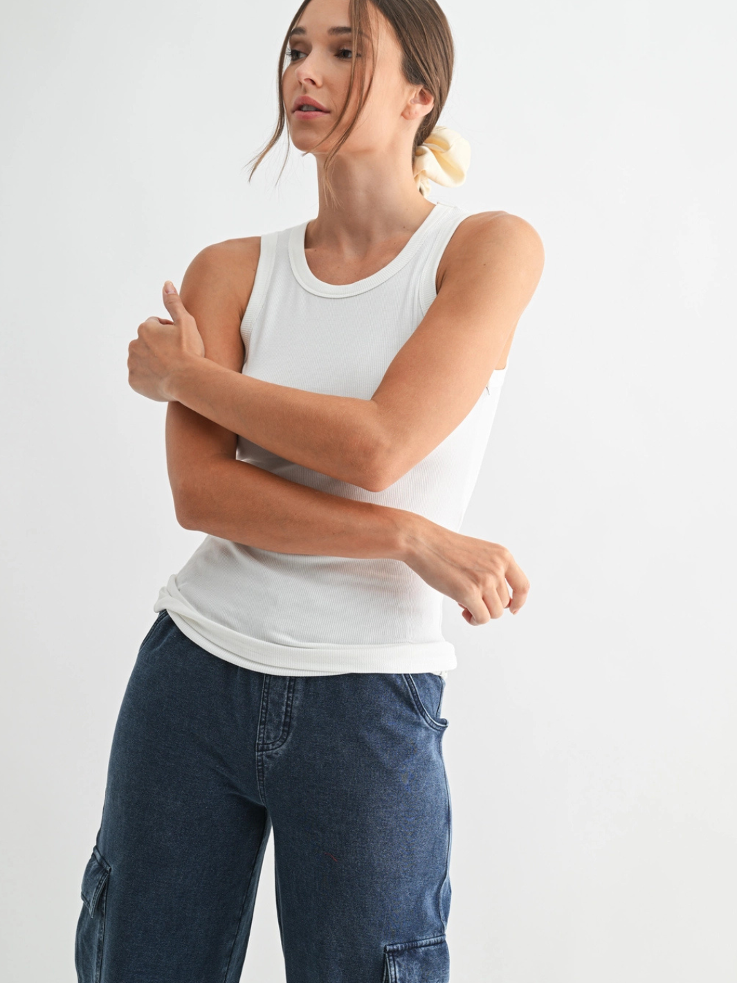 White Go-To Micro Rib Tank Top with a sleek, body-hugging fit and micro rib texture.