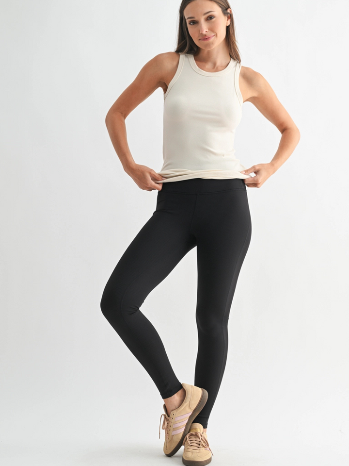 Go-To Micro Rib Tank Top on a model with black leggings, sleek body-hugging fit and ultra-soft rib texture.