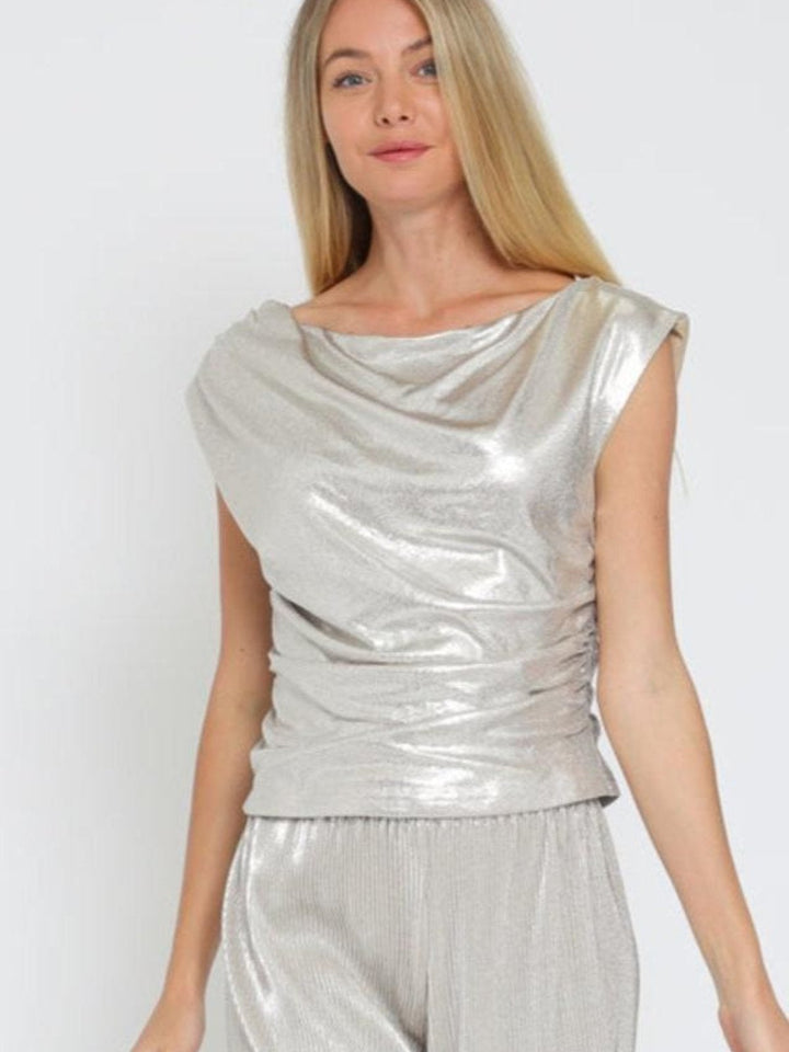 Eye-catching silver metallic set with a shiny texture and elegant cowl neck, perfect for any stylish occasion. JAZZY COWL NECK TOP JAYDEN P BOUTIQUE