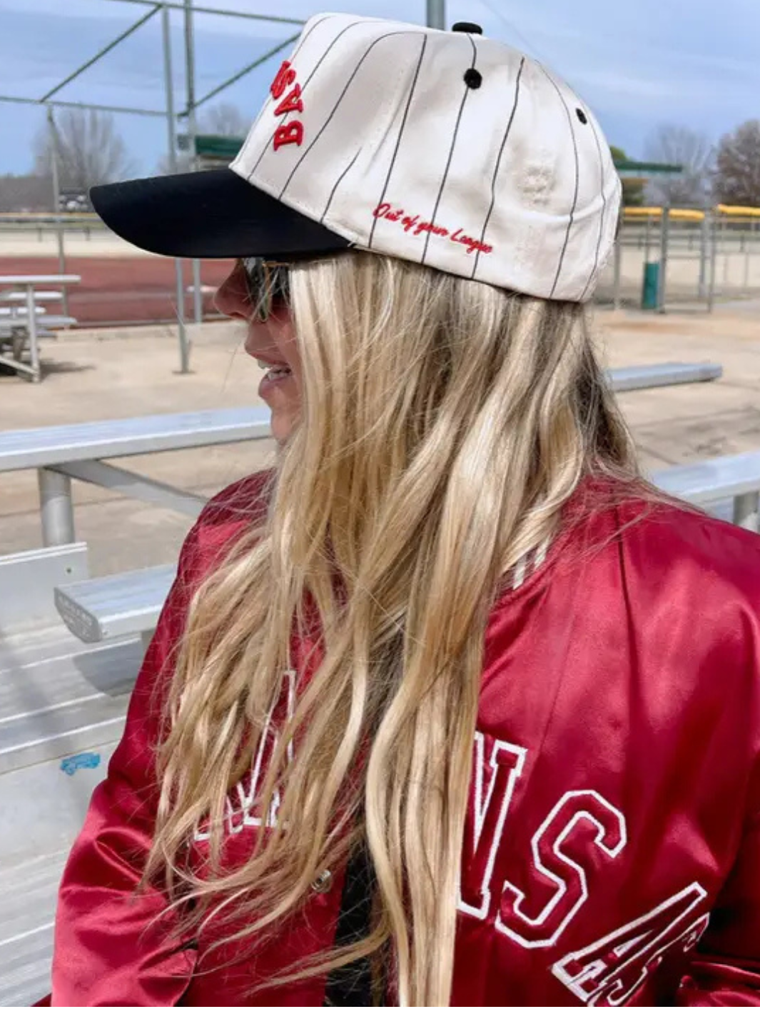 Fashionably showcasing the KENZKUSTOMZ - Baseball Stripe Trucker Hat, featuring bold stripes and vintage style.