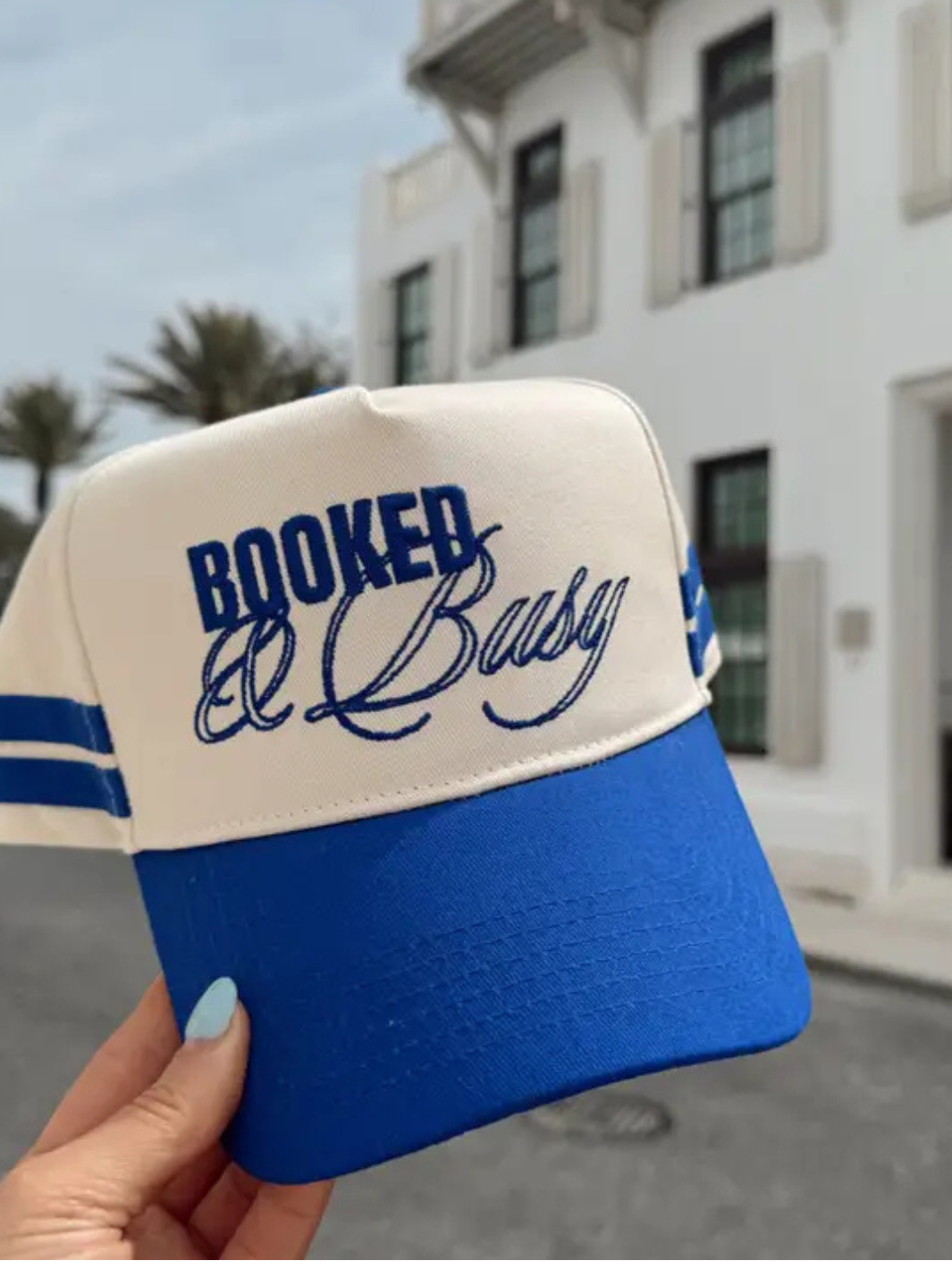 Royal blue KENZKUSTOMZ - Booked and Busy Vintage Trucker Hat with bold front embroidery, perfect for summer vibes.