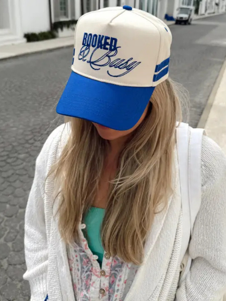 Stylish KENZKUSTOMZ - Booked and Busy Vintage Trucker Hat in royal blue, perfect for warm weather adventures.