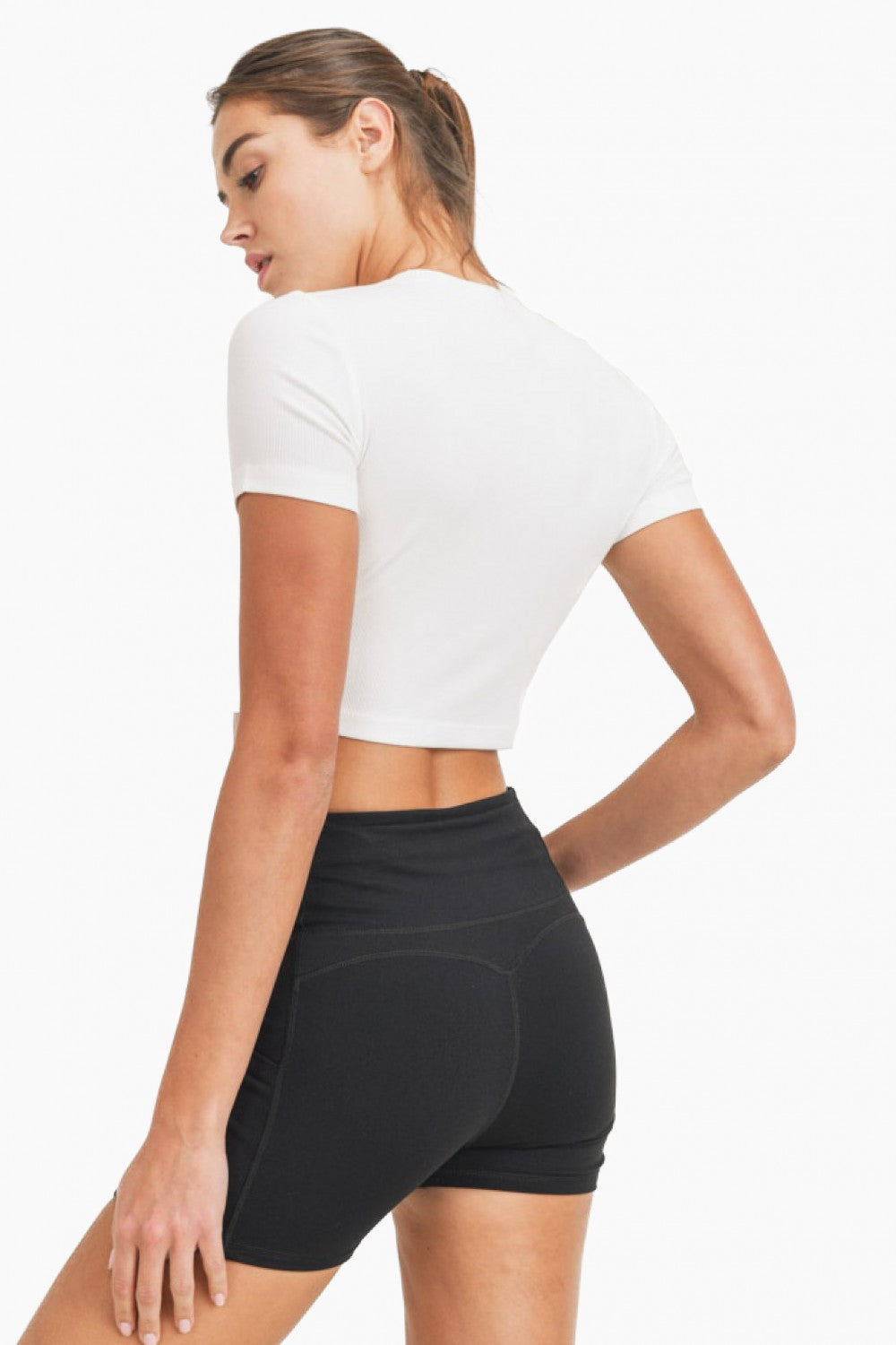Whether as a workout top (worn over a sports bra and a pair of leggings) or as a cute top (matched with a denim item), this cropped tee is as versatile as it is comfortable. It has short sleeves, a rounded neckline, and a form-fitting silhouette.