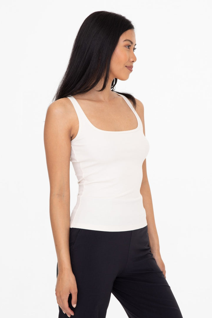 Made from a rayon blend for a soft touch, this classic rib tank top is your next go to piece. The square neck and slim strap combination is ultra flattering and makes this piece perfect for layering.