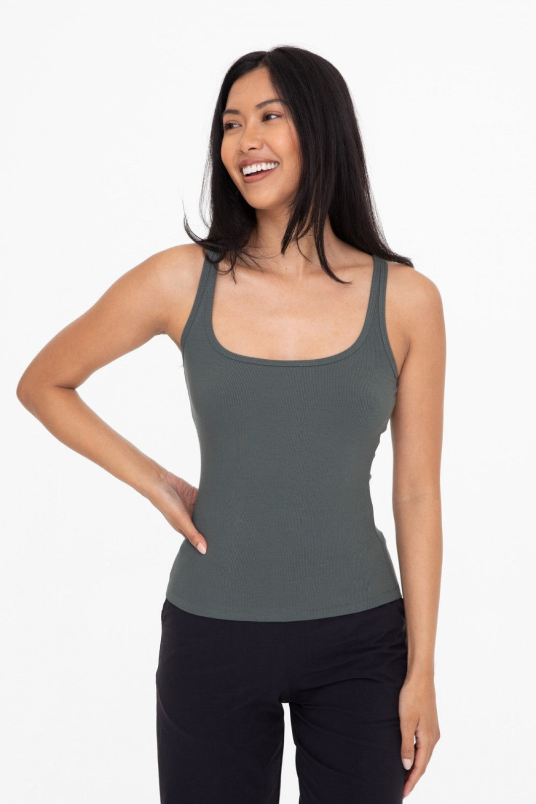 Made from a rayon blend for a soft touch, this classic rib tank top is your next go to piece. The square neck and slim strap combination is ultra flattering and makes this piece perfect for layering
