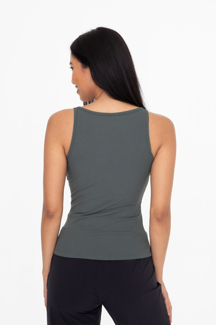 Made from a rayon blend for a soft touch, this classic rib tank top is your next go to piece. The square neck and slim strap combination is ultra flattering and makes this piece perfect for layering