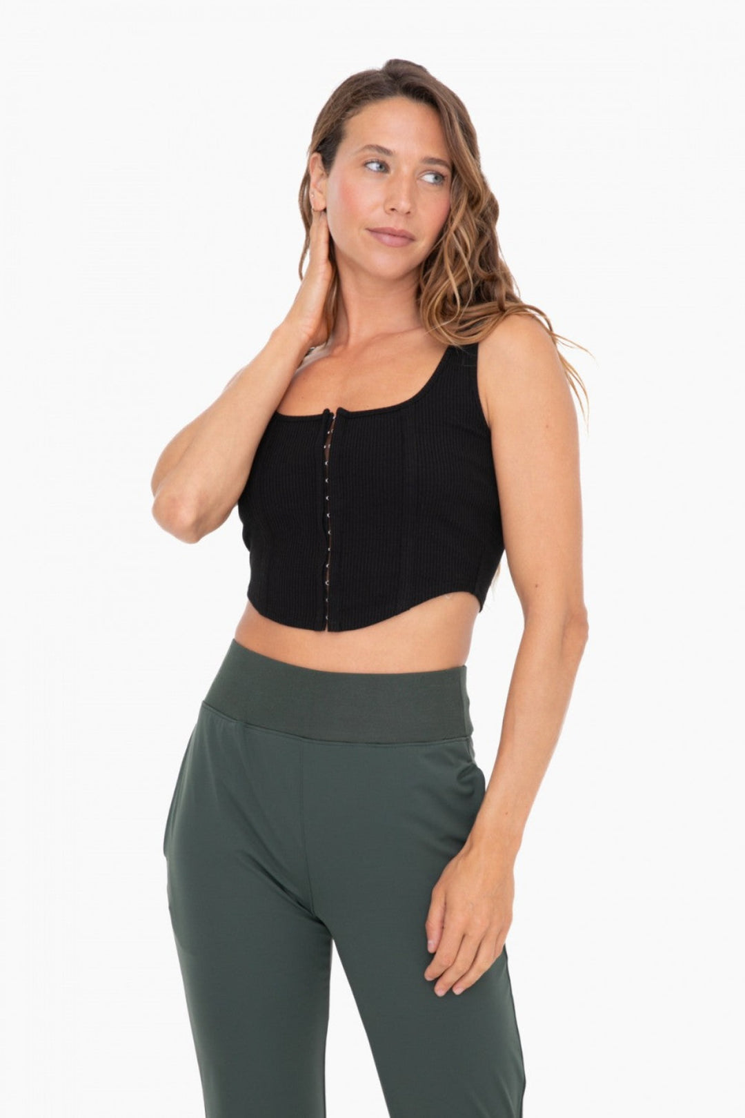 Be cute and comfy in this corset style rib top. Made from a cotton blend fabric, this top features a full front hook and eye closure, a contoured hem, and a flattering square neckline.