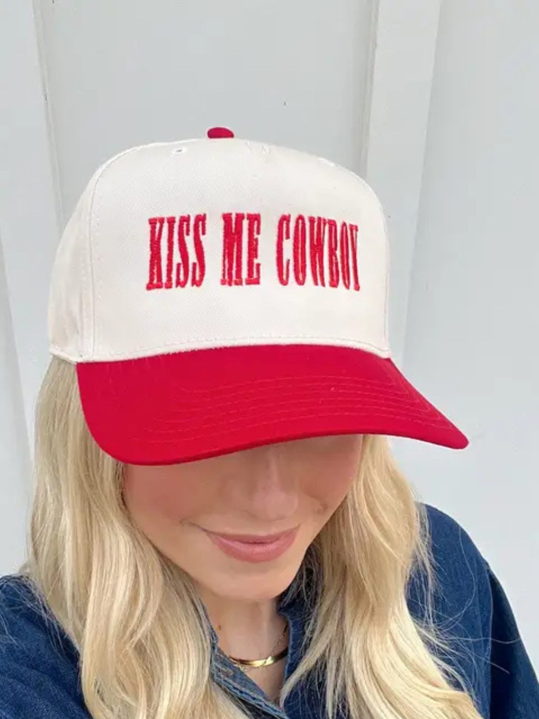 Stylish Kiss Me Cowboy Baseball Hat in red and natural with bold embroidery, perfect for cowgirls looking to stand out.