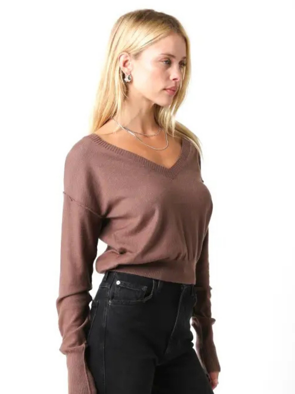 Model wearing Loren Lightweight V-Neck Knit Sweater in mauve, a lightweight V-neck pullover with long sleeves.
