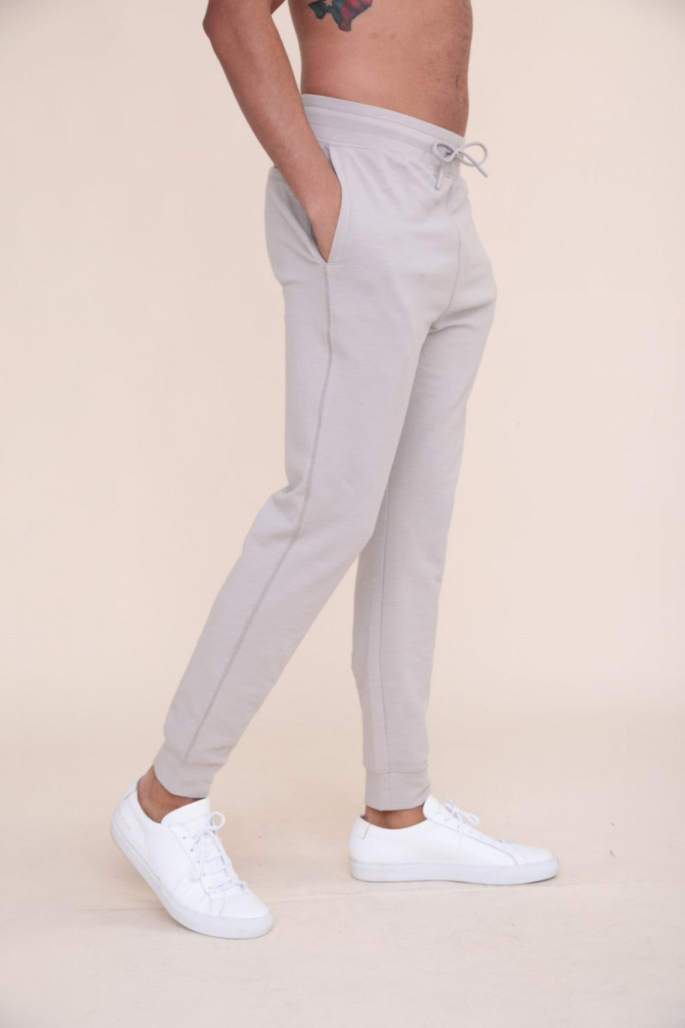 Keep it simple with these elevated joggers. They have a drawstring waistband, single zipper back pocket, and a stitch part way up the back of the legs.