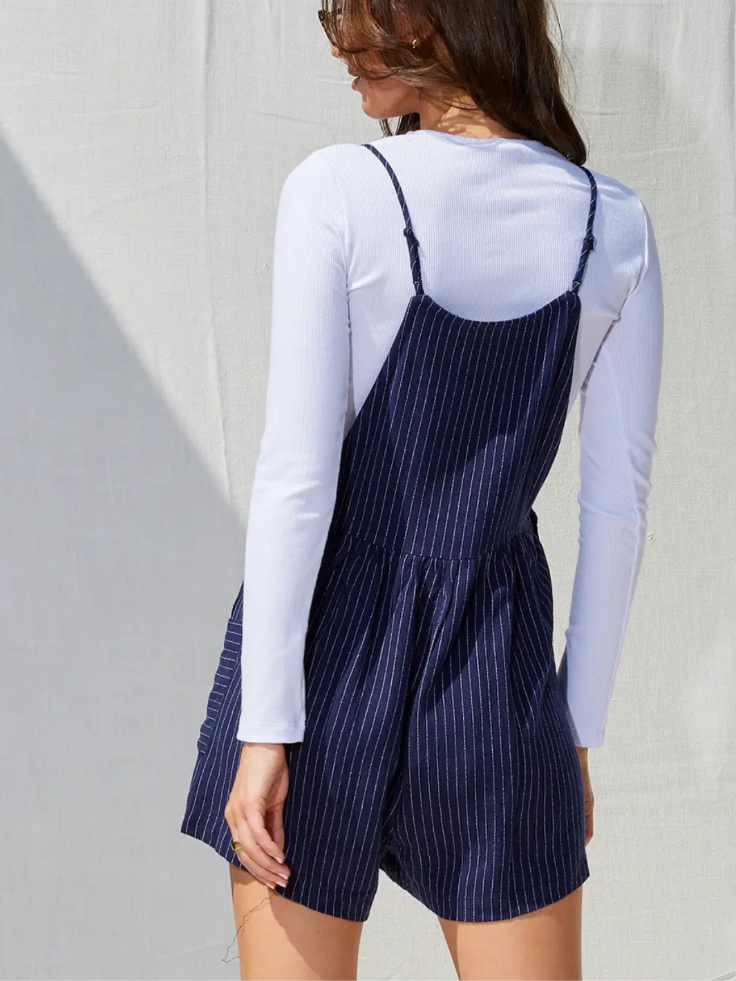Stylish Northwest Striped Linen Pocketed Romper featuring a relaxed fit and adjustable spaghetti straps for effortless charm.