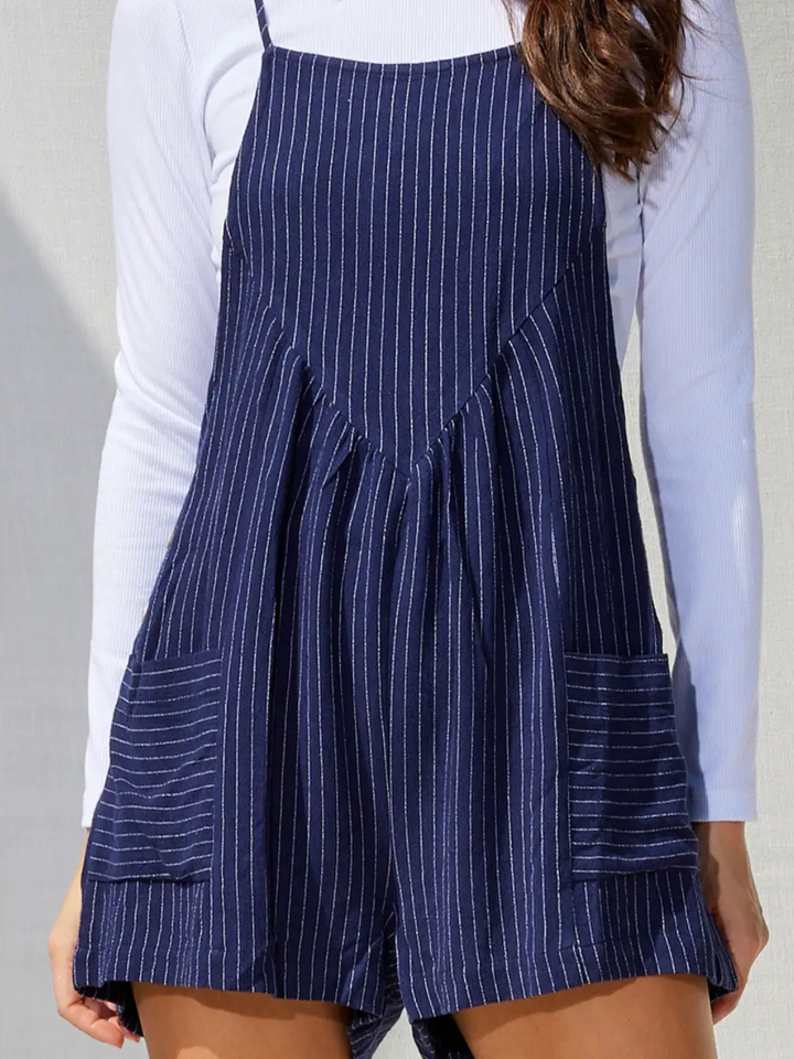 Chic Northwest Striped Linen Pocketed Romper with a relaxed fit, adjustable straps, and side pockets for effortless style.