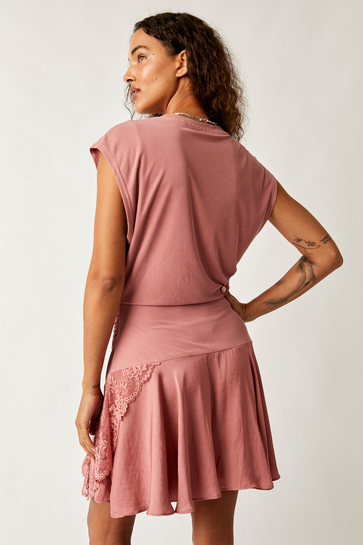 Step out in style in this flirty little number! The Free People Jazzy Mini Dress features a crew neckline, short sleeves, and a synched waistline, all adorned with elegant satin lace trim. Look stunning and feel confident in this sassy yet sophisticated dress!