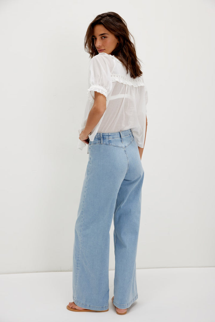 FREE PEOPLE Libre Wide Leg Jeans in light wash; retro high-rise with seamed panels.