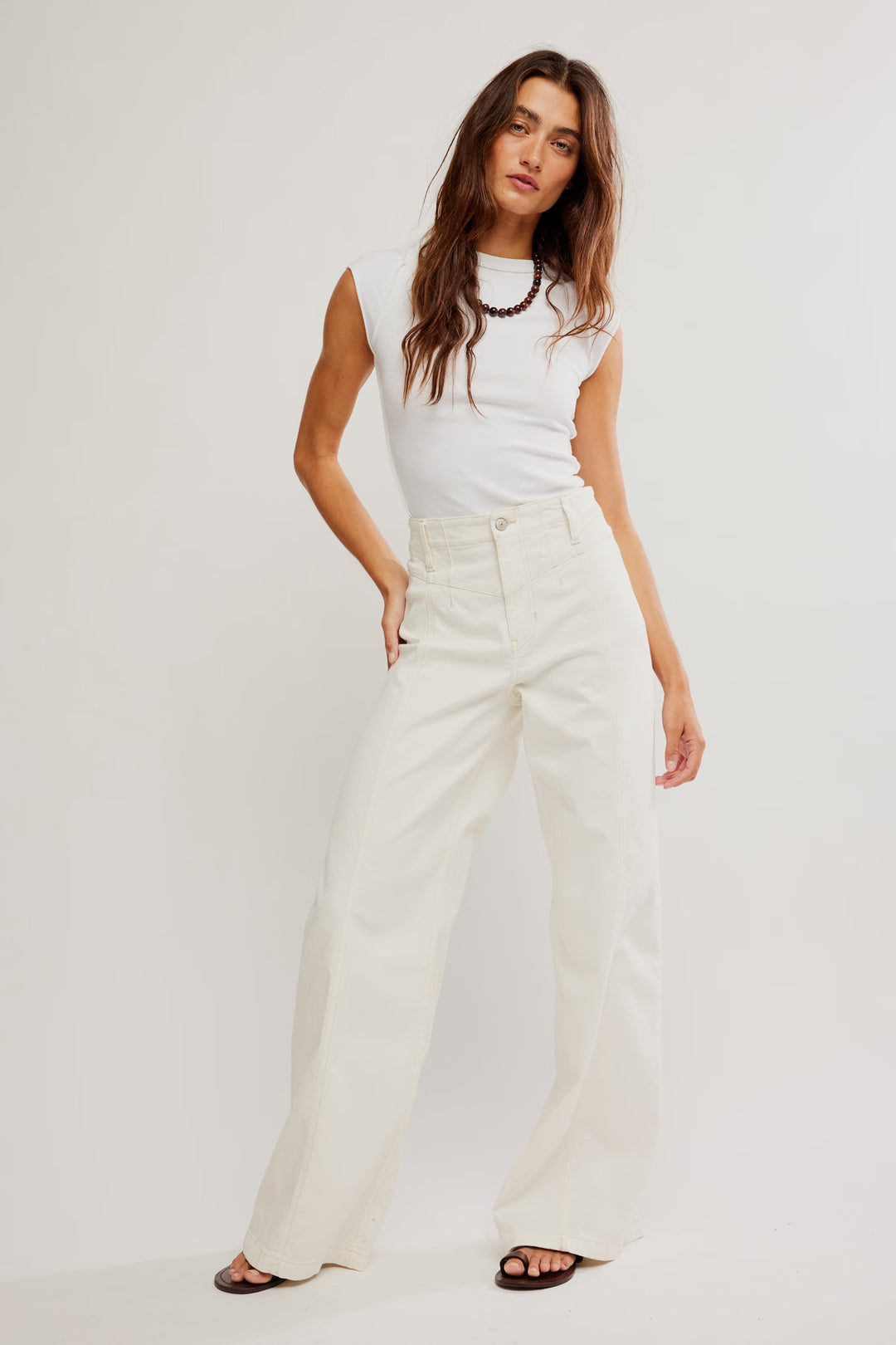 Free People Libre Wide Leg Jeans, cream high-rise denim with seamed panels and retro wide-leg silhouette.