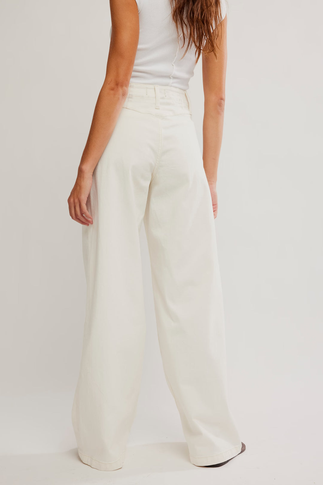 FREE PEOPLE Libre Wide Leg Jeans in ivory, high-rise, wide-leg silhouette, back view on model.