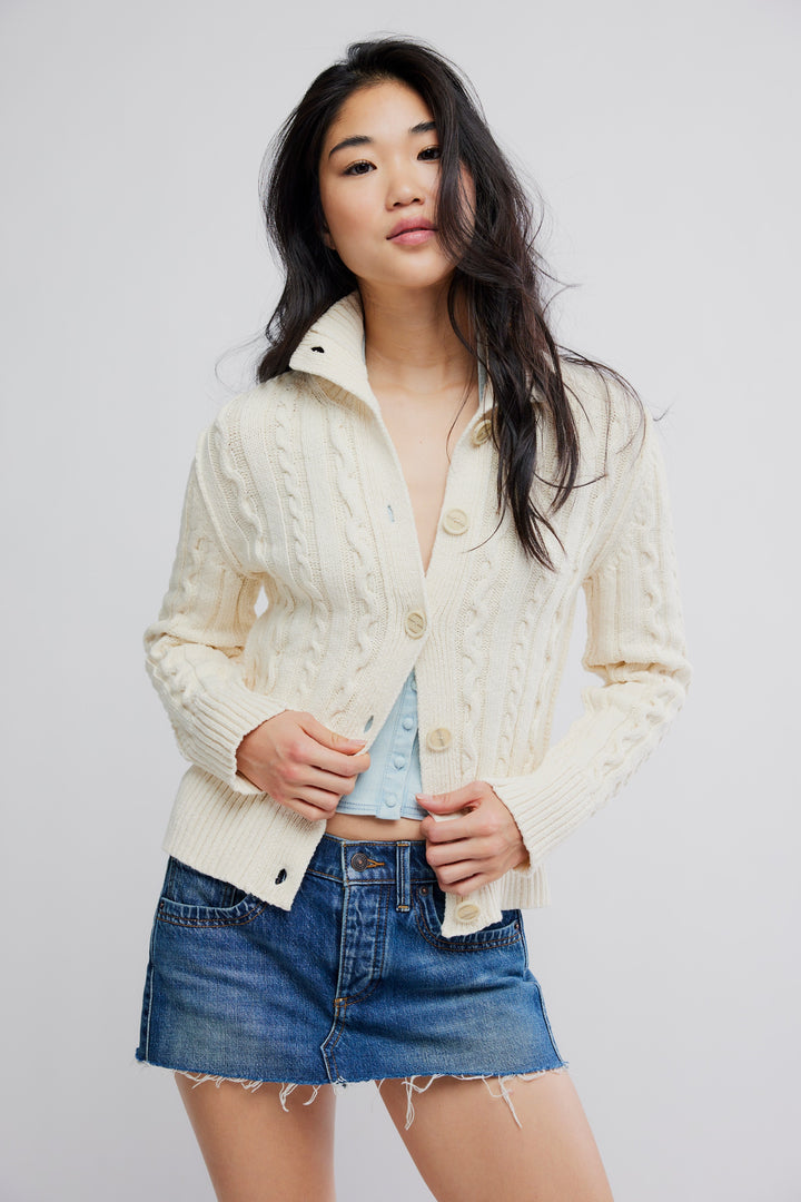 Free People WTF Cable Collar Cardigan: cream cable-knit with chunky collar and buttons over light blue top.