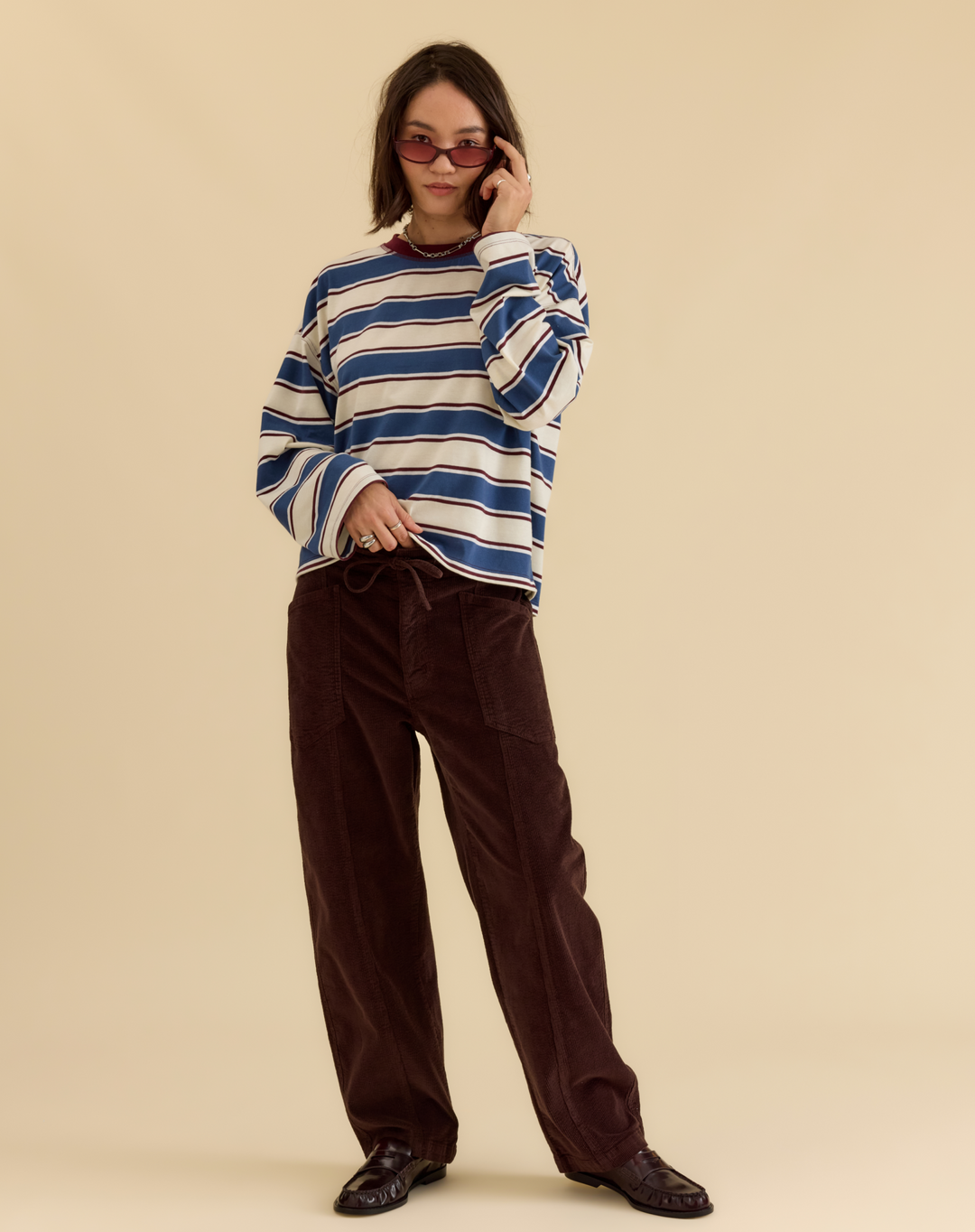 Daze Denim Villa Corduroy Drawstring Barrel Pants in Chocolate — full-length front view styled with striped sweater and loafers | Jayden P Boutique