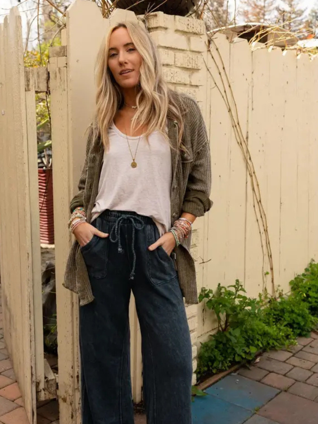 Model wearing Relaxing Robin Wide Leg Pant with drawstring waist in boho style outdoors.