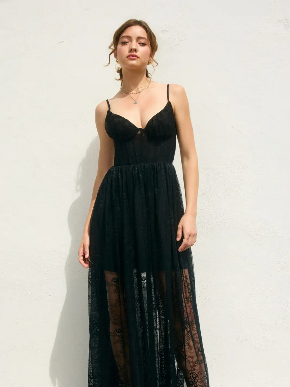 Ethereal and elegant, the She Is Radiance Corset Maxi Dress features a fitted bodice and flowing chiffon silhouette.