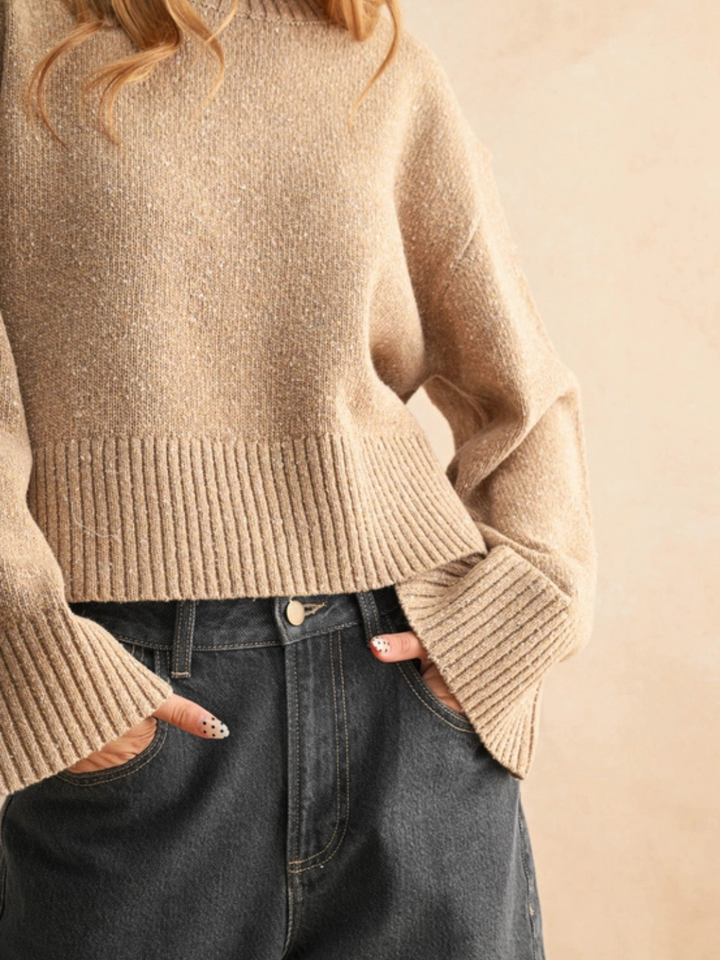 Beige Sprinkled Effect Sweater with subtle shimmer, relaxed fit, ribbed hem, paired with dark jeans.