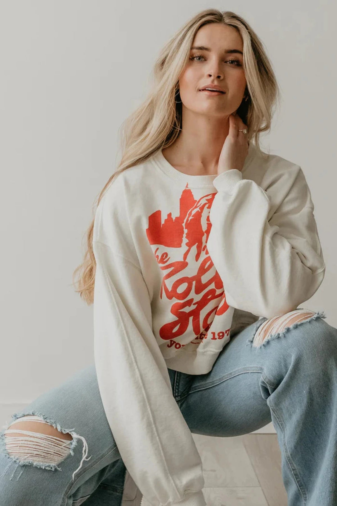 Casual style: a woman in a white Rolling Stones sweatshirt and jeans People of Leisure