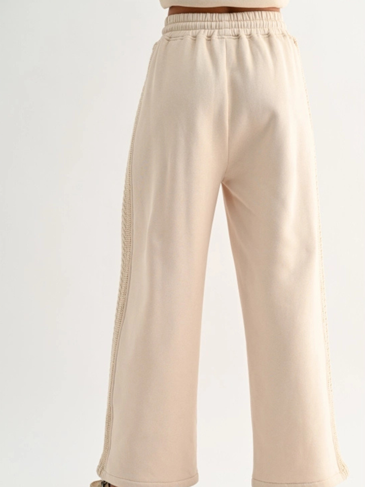 Aria Cable Knit Wide Leg Pant in beige with elastic waist and cable-knit side trim for lounge wear.