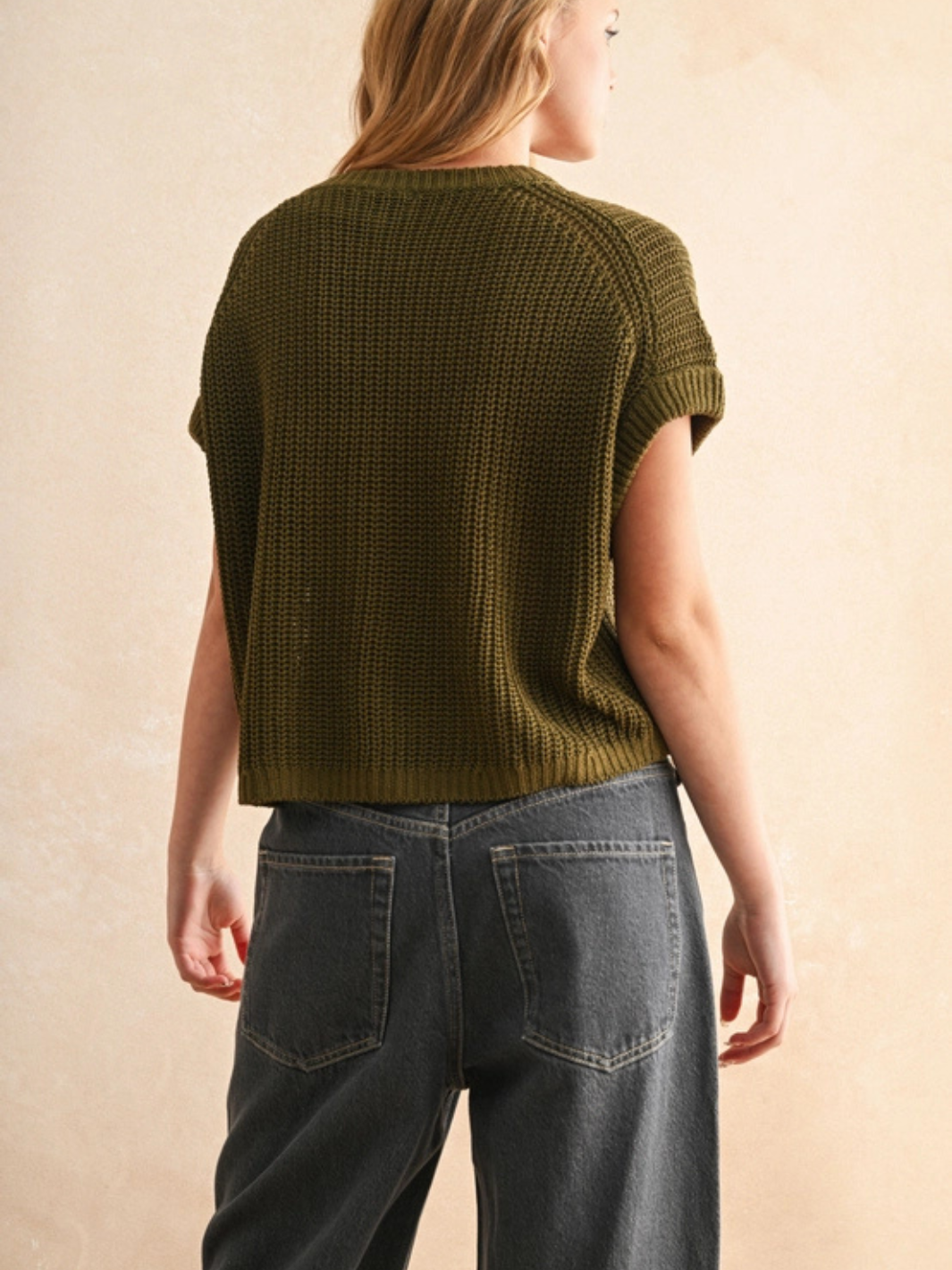 The Capsule Knit Sleeveless Sweater Top in olive knit; relaxed boxy fit, laid-back luxe.
