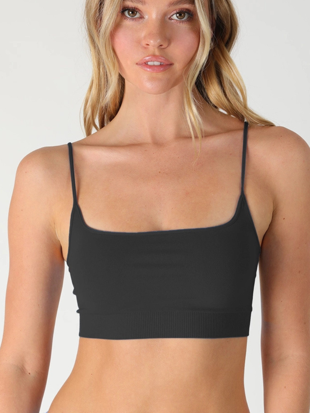 The Core Micro Bralette Top in black with a sleek square neckline, seamless stretch fabric, and thin straps.