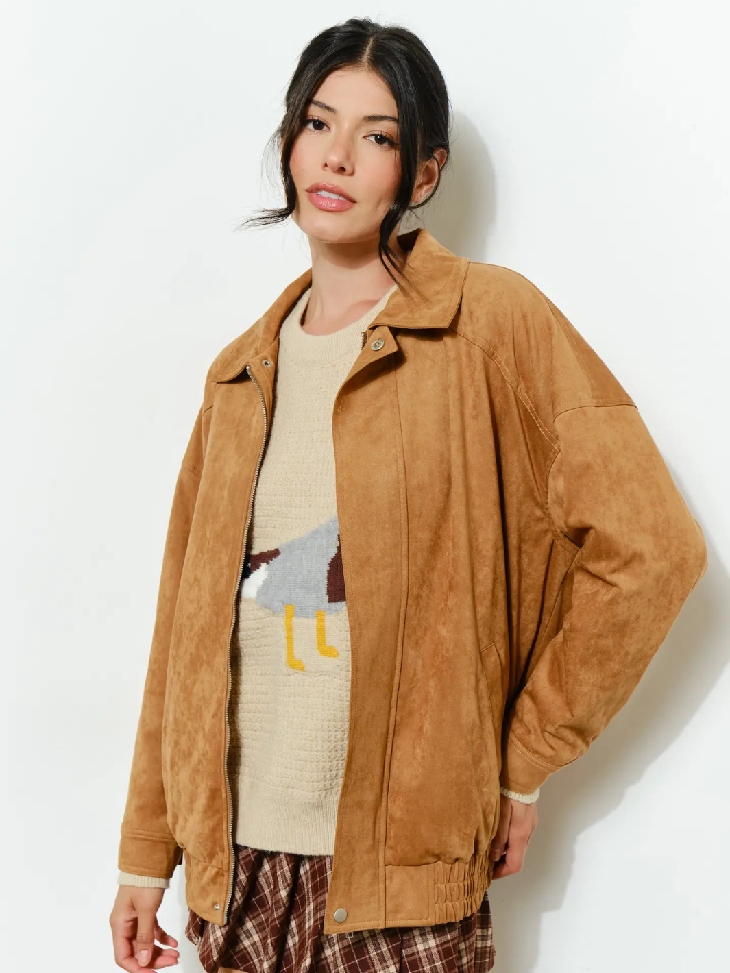 The Halow Vegan Oversized Suede Jacket worn by a model in tan vegan suede with a beige knit sweater.
